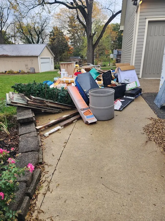 Dumpster being loaded with debris for 30 Yard Dumpster Rental in Braintree Town
